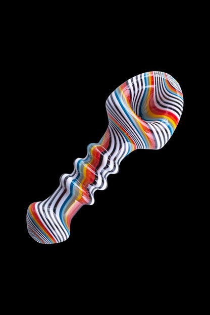 Colorful glass pipe with swirling stripes and a uniquely shaped bowl, isolated on a black background.