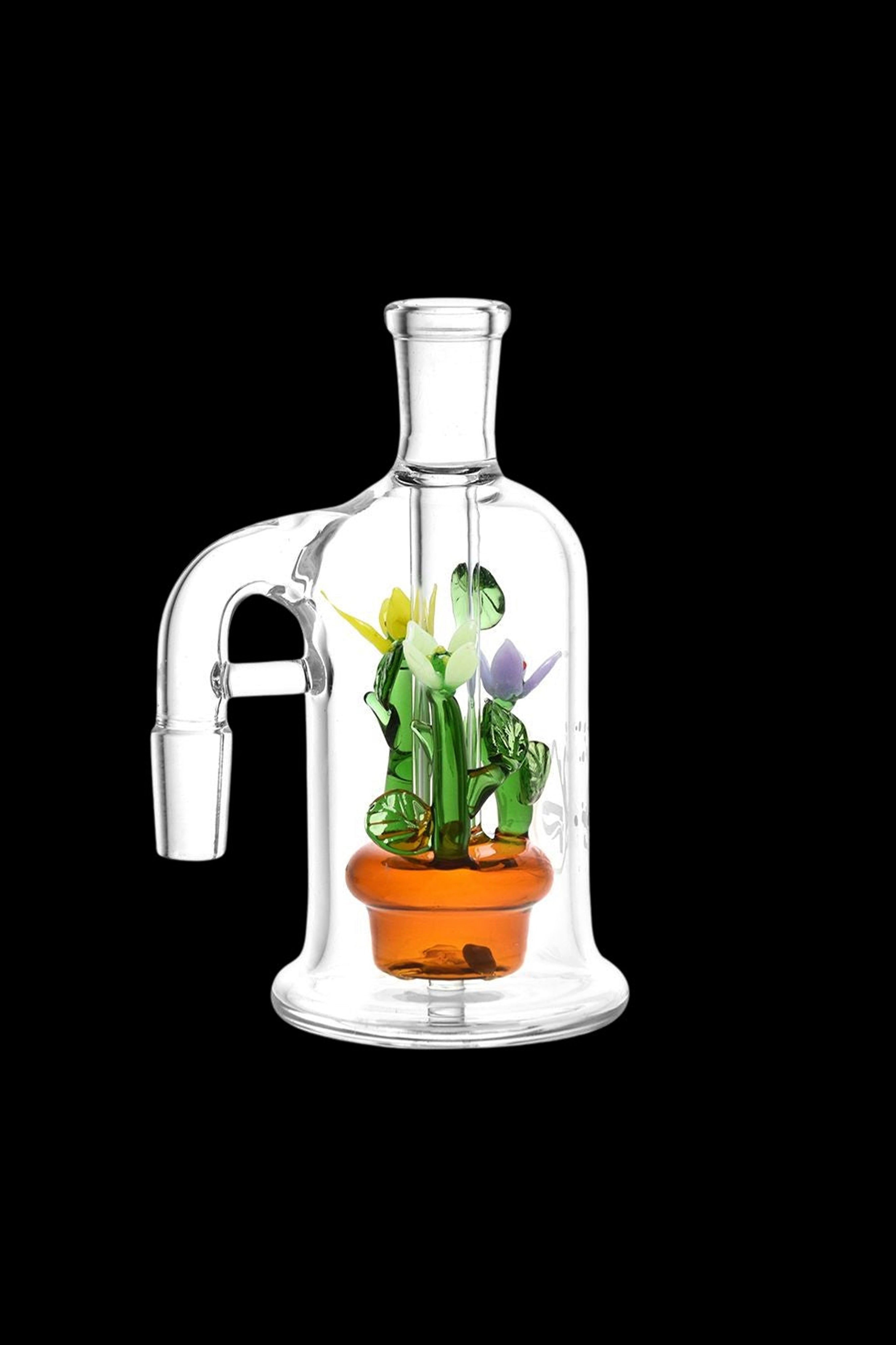 Clear glass bubbler water pipe with sculpted cannabis plant inside.