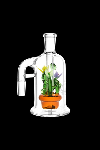 Clear glass bubbler water pipe with sculpted cannabis plant inside.