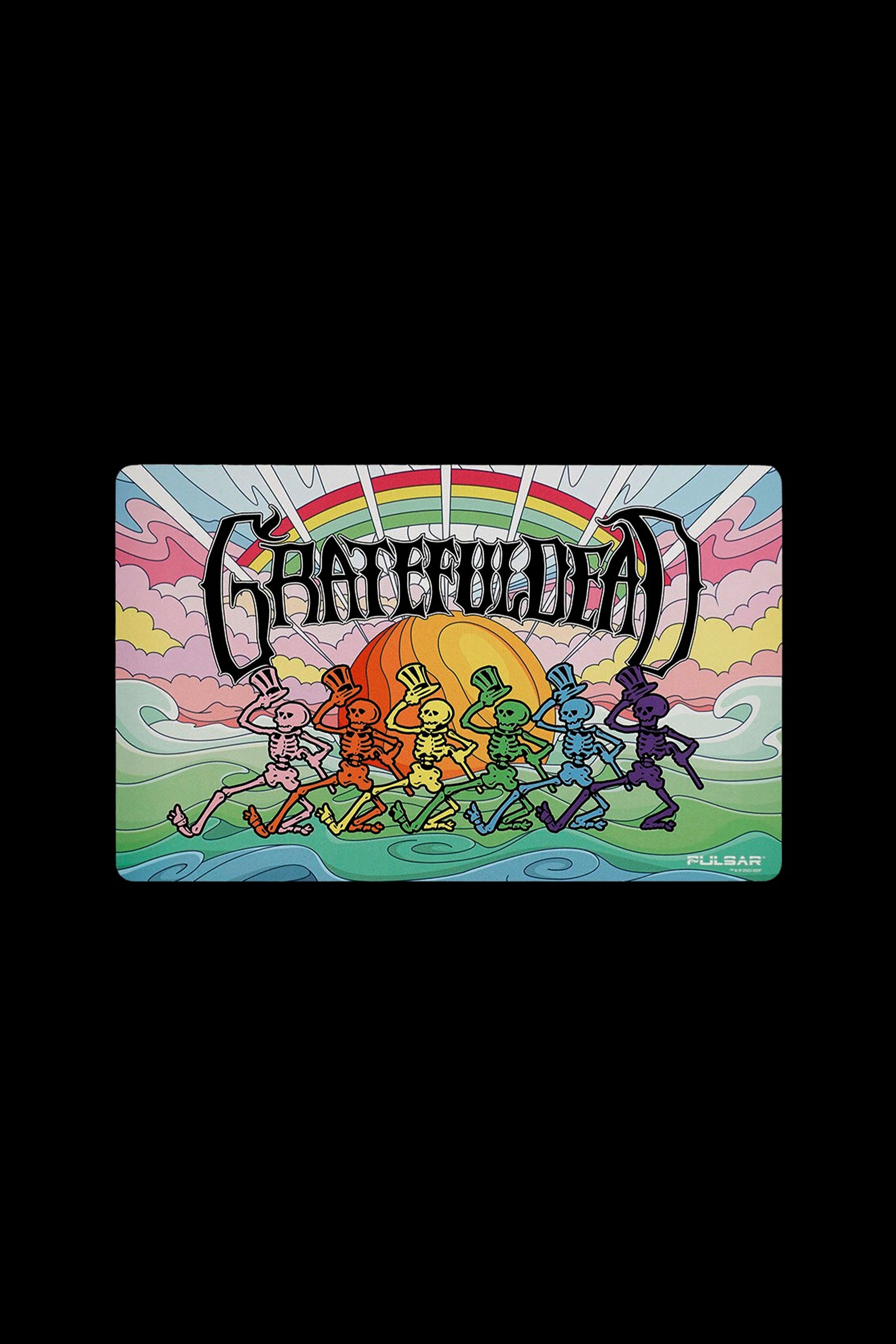 Retro-style illustration of dancing skeletons under a sunset with “Grateful Dead” text above, branded with “Pulsar” logo.