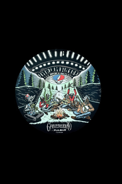 Illustration of skeletons around a campfire in a forest, branded with the Grateful Dead and Pulsar logo, suggestive of cannabis culture."