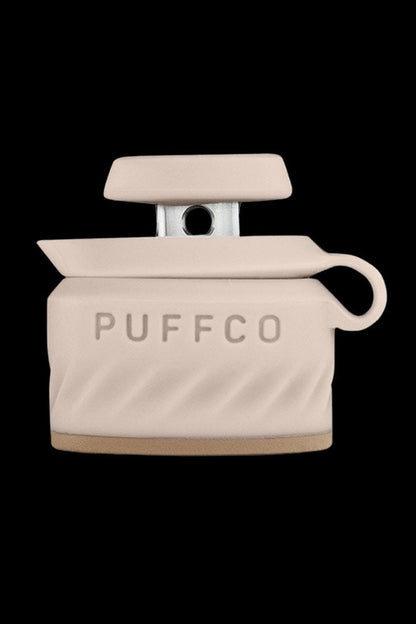 Beige Puffco Peak Pro portable dab rig with branding.
