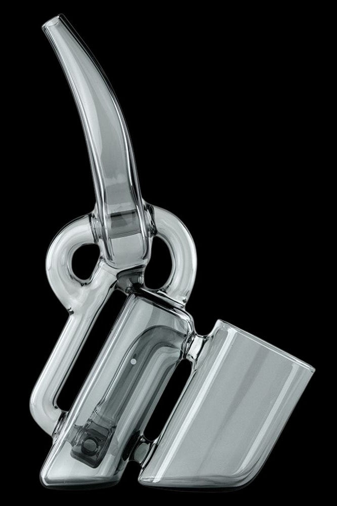 Clear glass rig for vaporizing concentrates, with a bubbler and angled mouthpiece.