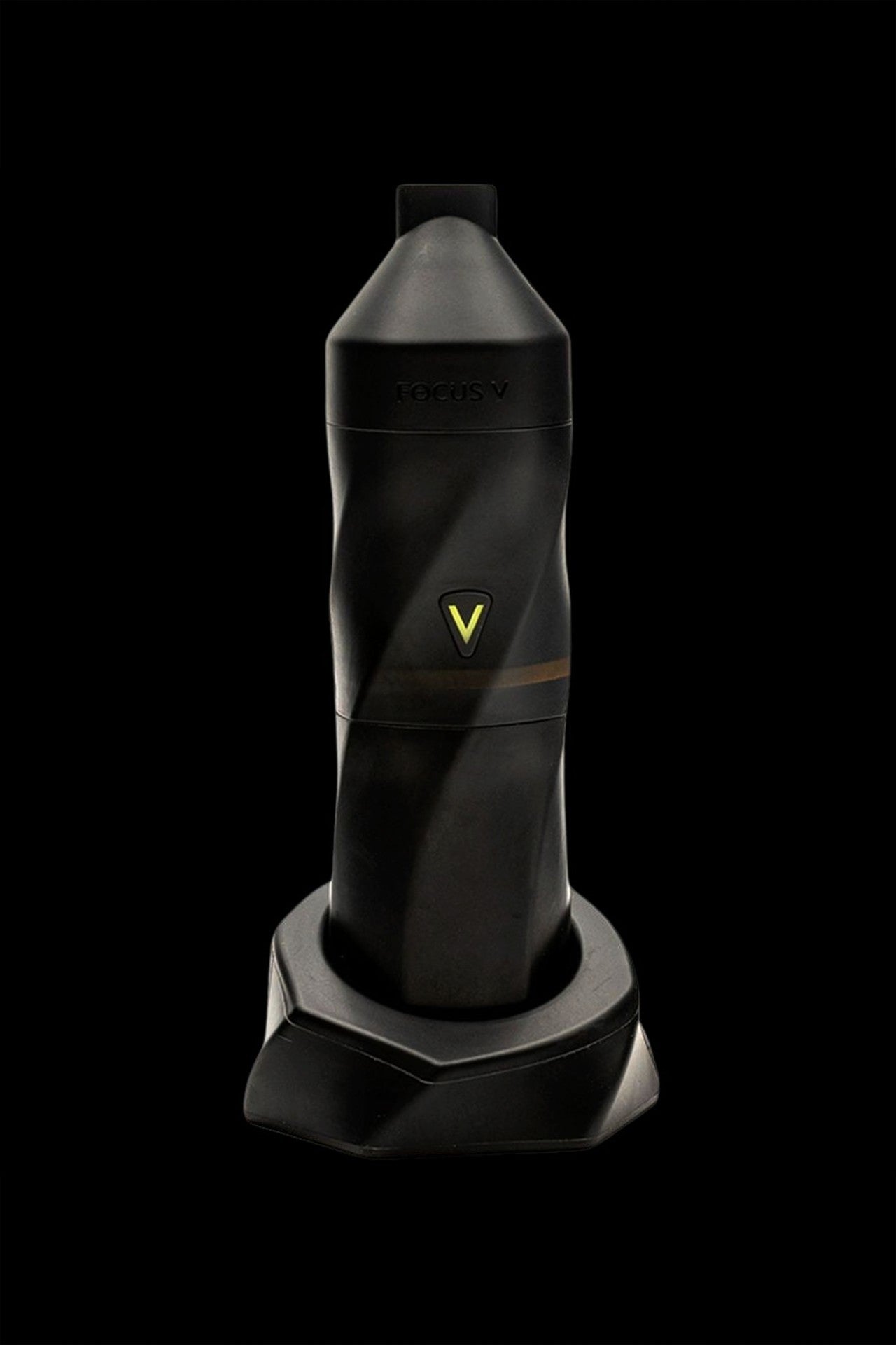 Black cannabis vaporizer pen standing in a charging base.