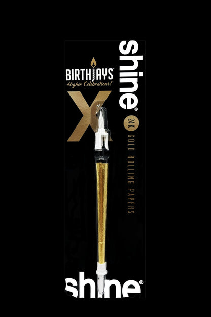 Gold rolling papers in a tube with “Shine” and “Birthdays” branding.