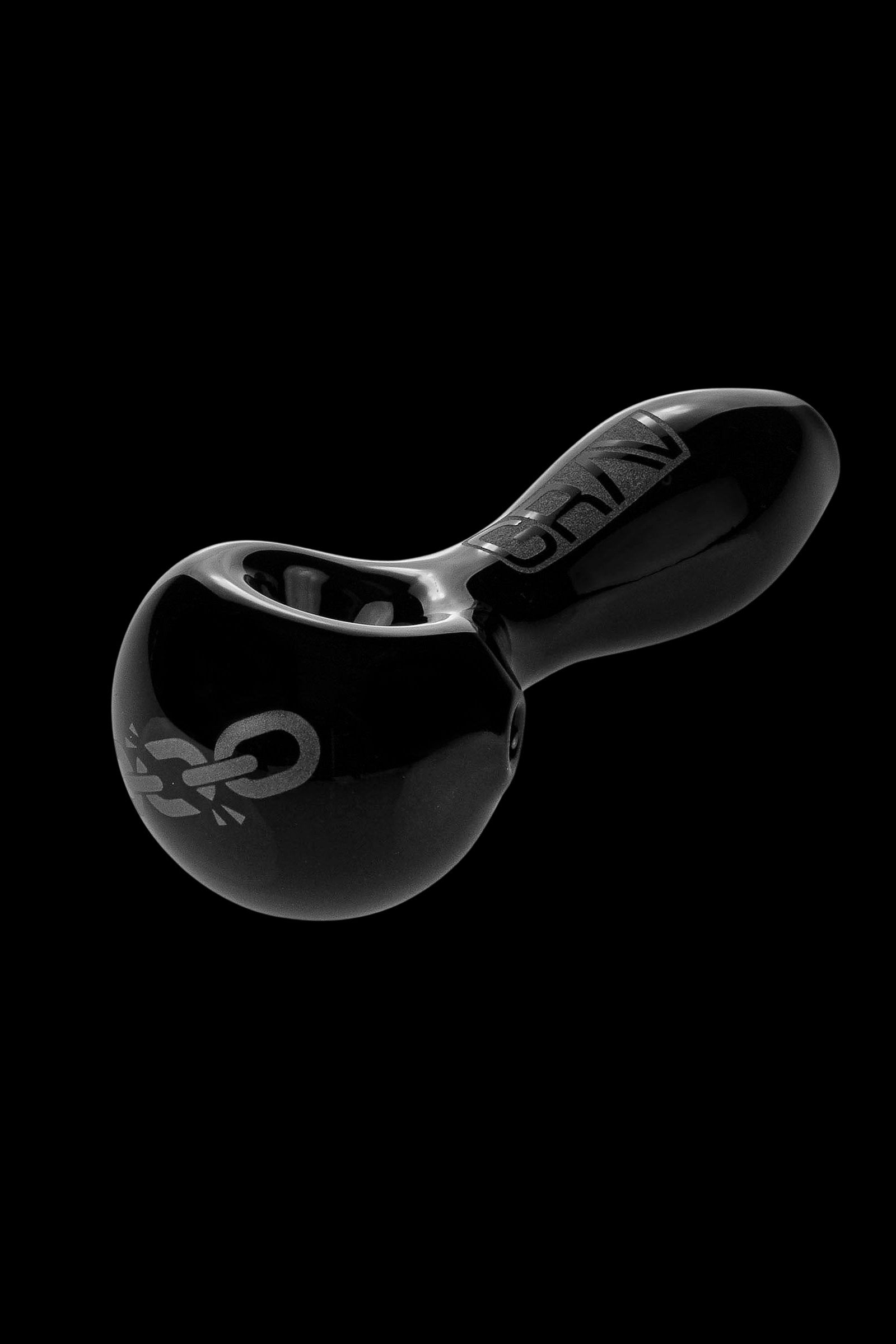 Black glass cannabis oil rig with intricate design.