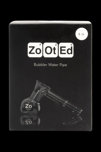 Product shot of a “Zooted” branded bubbler water pipe in its black retail box.