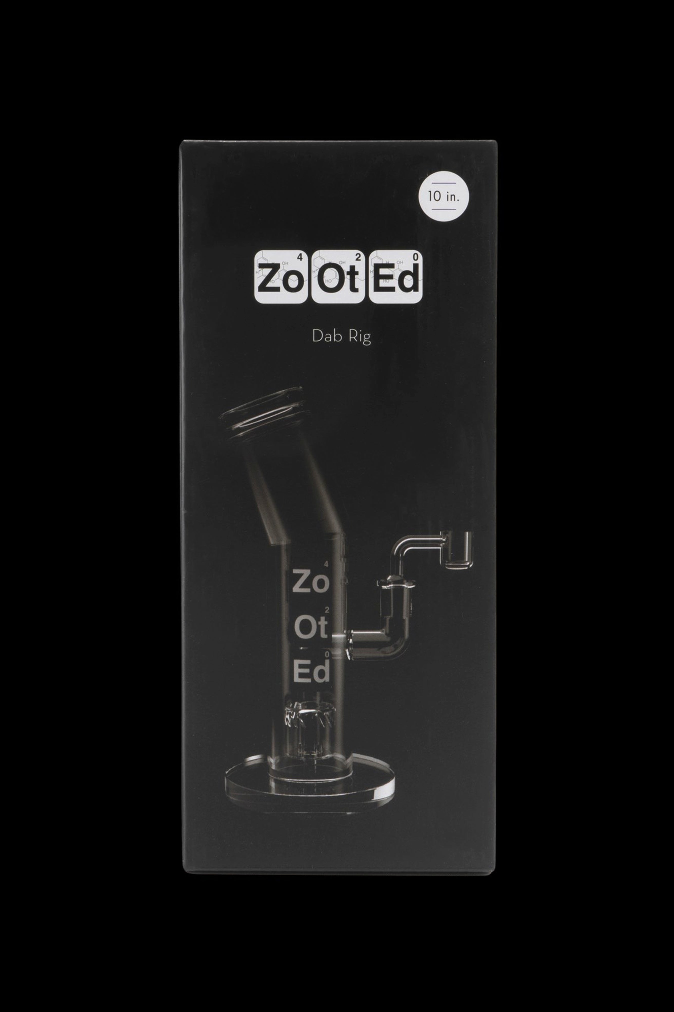 Black box displaying a glass dab rig with "Zo Ot Ed" branding and "10 in." sticker.