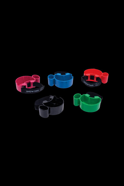 Colorful, modular cannabis accessory organizers displayed against a black background.