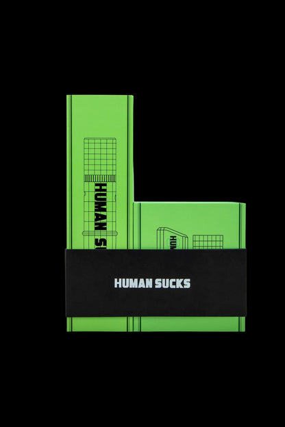 Green glass cannabis water pipe with "HUMAN SUCKS" text.