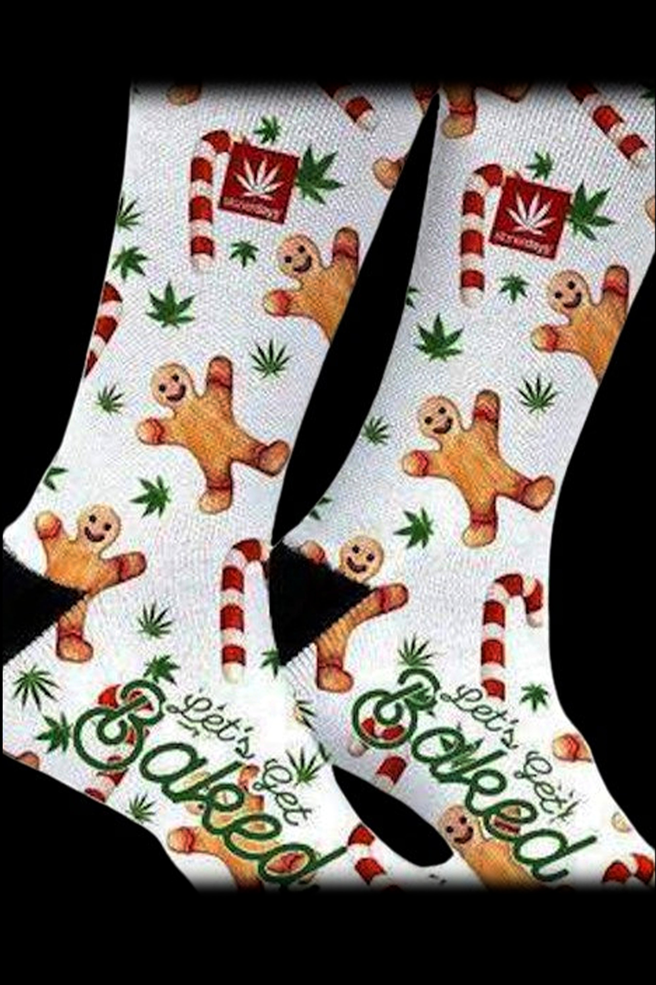 Knee-high cannabis-themed socks with a gingerbread man and marijuana leaf pattern, reading "Let's Get Baked."