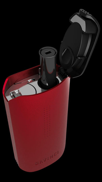 Red DaVinci IQ2 portable cannabis vaporizer with open chamber.
