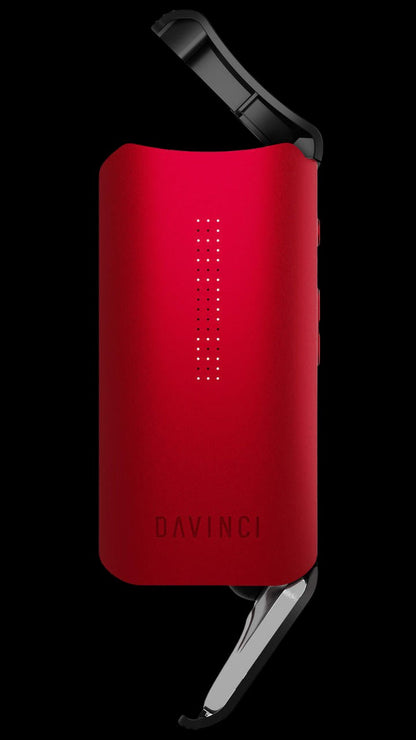 Red DaVinci IQ2 portable cannabis vaporizer with open mouthpiece.