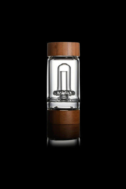Glass bubbler with wooden accents against a black background.