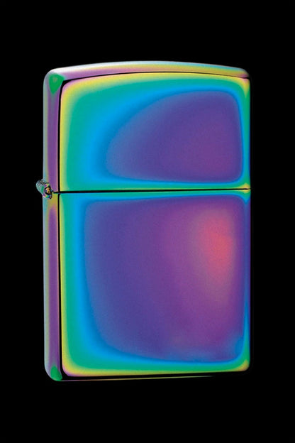 Iridescent Zippo lighter with a rainbow oil slick effect, against a black background.