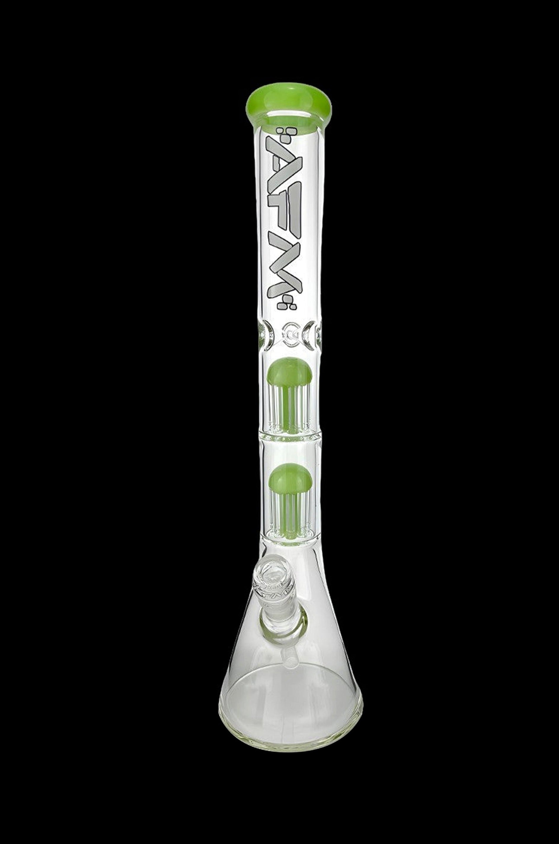 Clear glass bong with green accents and multiple filtration chambers.