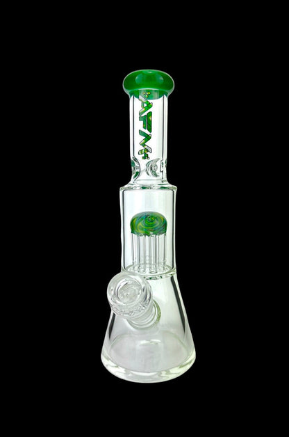 Clear glass water pipe (bong) with green accents and intricate percolators, isolated on a black background.