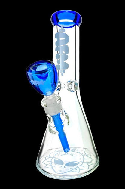 Blue glass bong with patterned base and bowl piece.