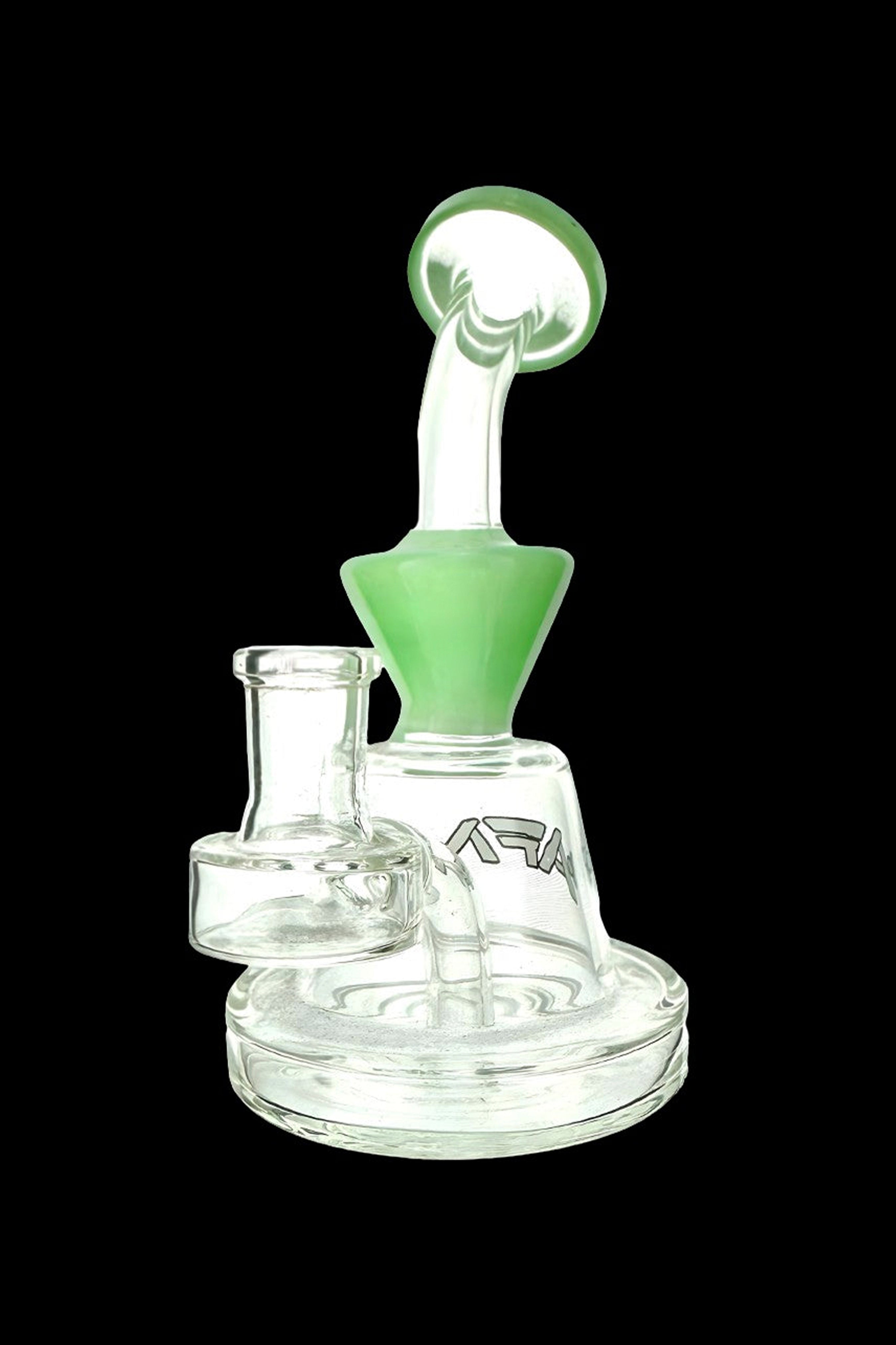 Clear glass rig with green accents, featuring a bubbler design and a branded logo.