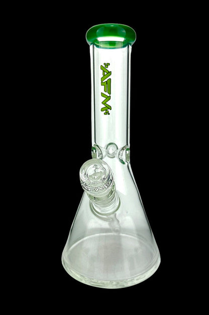 Clear glass beaker bong with green accents and a glass bowl.