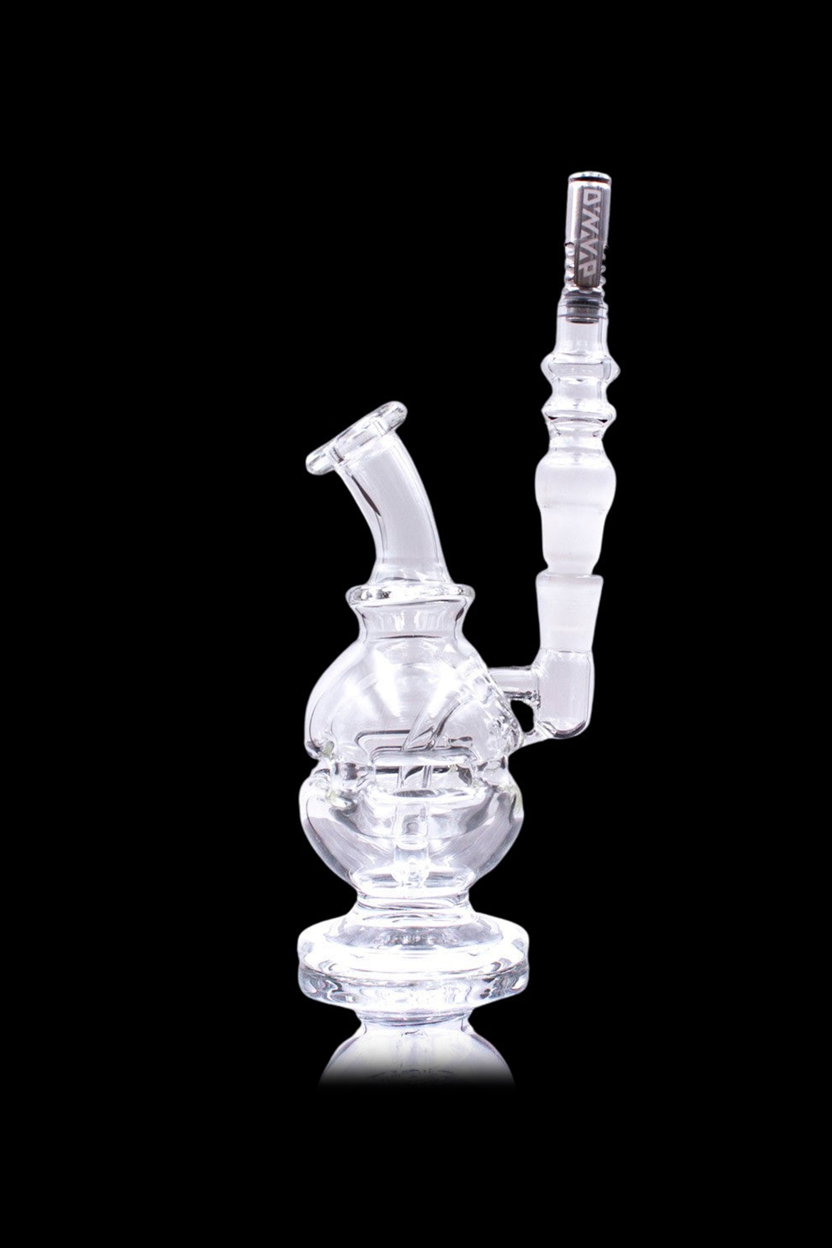 Clear glass water pipe (rig) with intricate design, isolated on black.