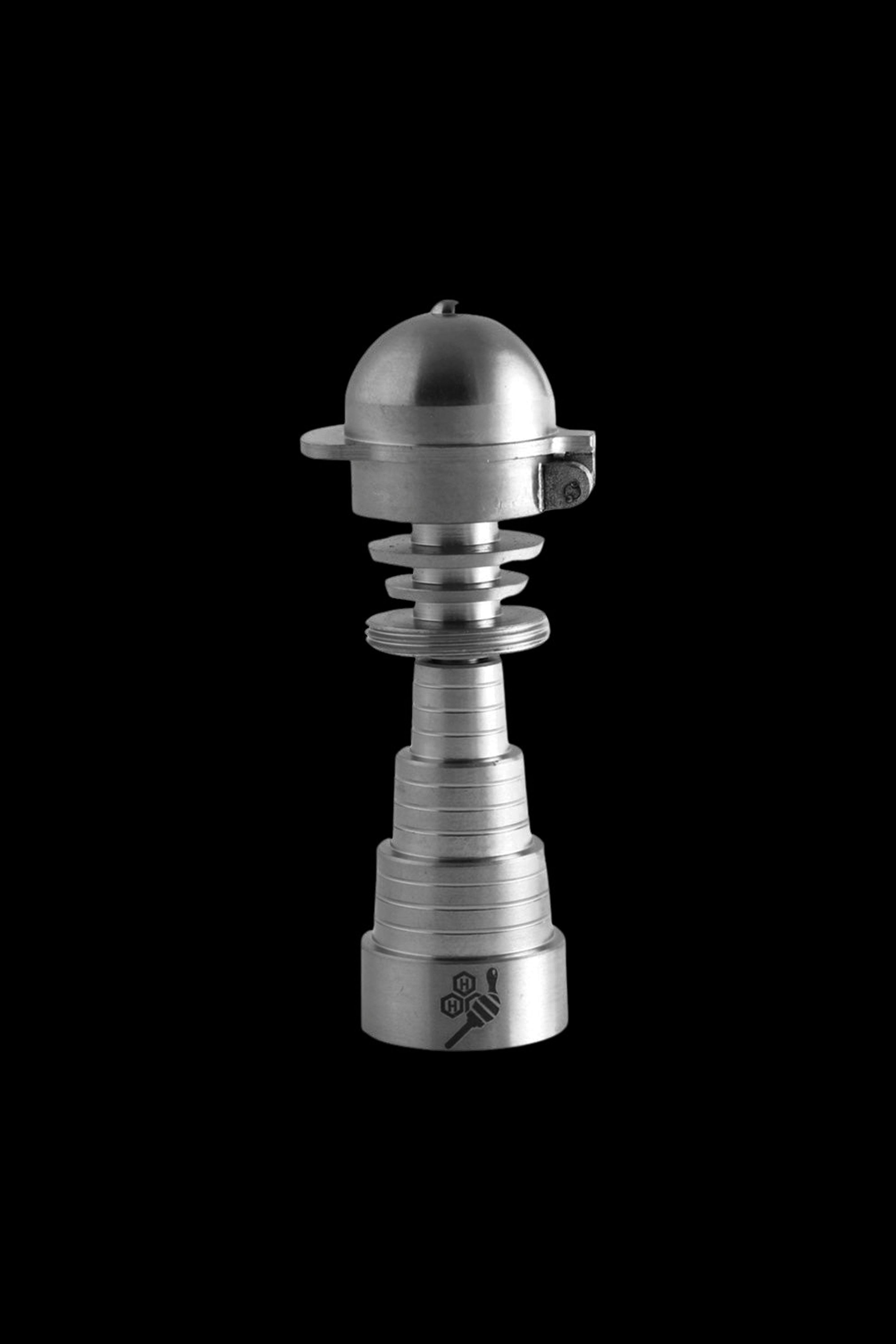 Silver cannabis oil vaporizer or dab rig on a black background.