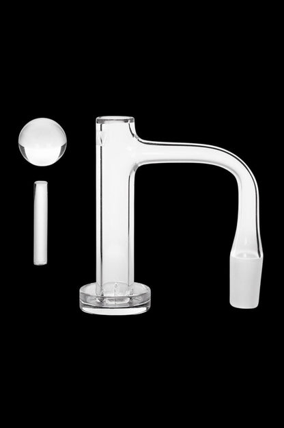 Clear glass dab rig with a carb cap, isolated on a black background.