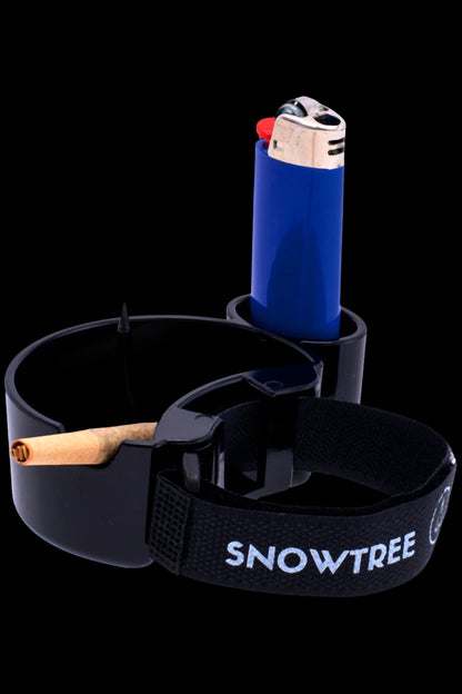 Black ashtray with a partially smoked joint and a blue lighter, branded with “SNOWTREE”.