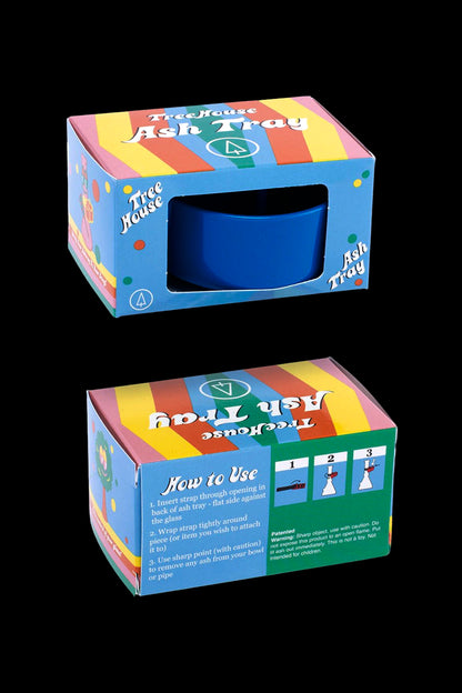 Product packaging for a colorful, plastic "Treehouse Ash Tray" with instructions for use.