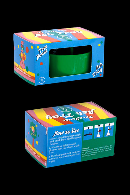 A closed, colorful cardboard box for a "Tree House Ash Tray" with instructions on how to attach it to glass smoking equipment.