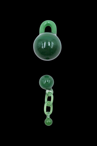 Emerald green glass lock and chain cannabis accessory against a black background.
