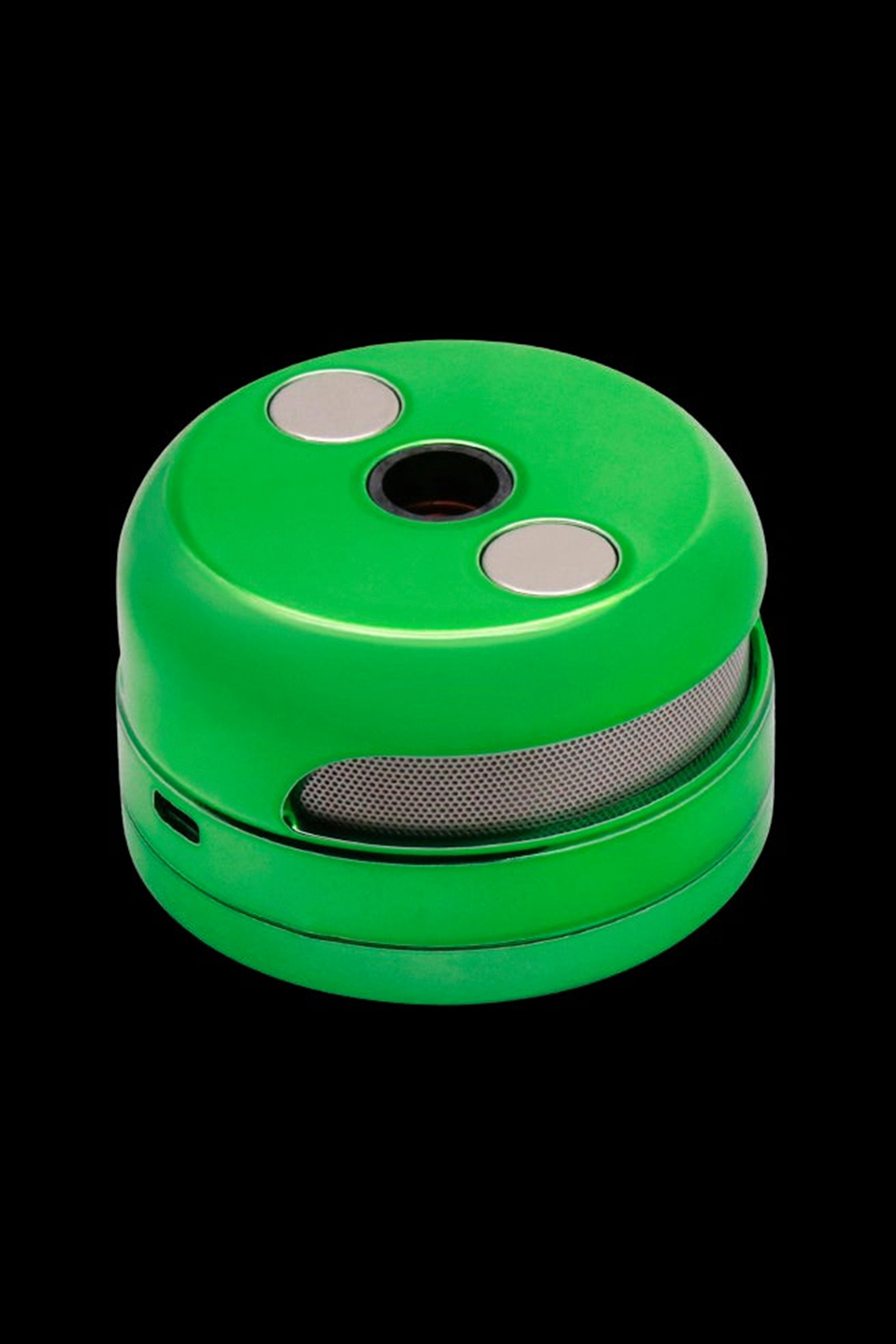 Green cannabis grinder with a metallic mesh midsection and silver buttons.
