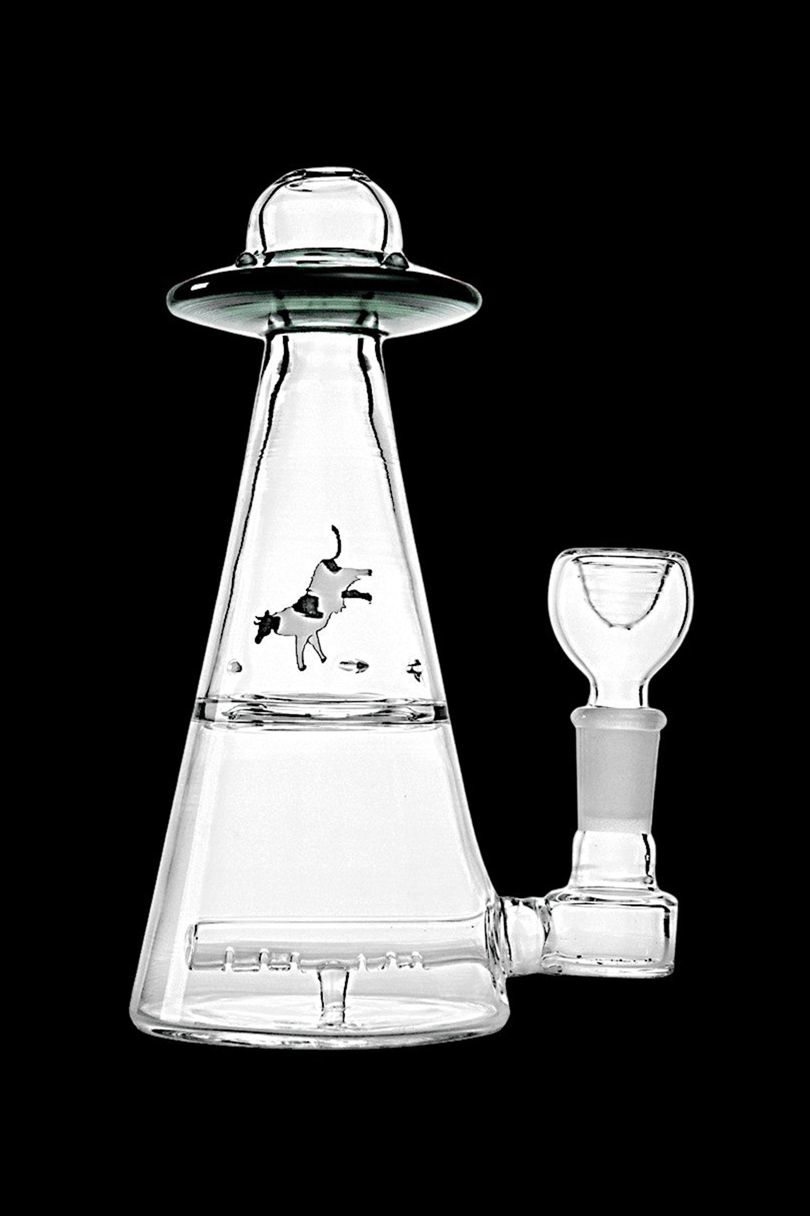 Clear glass water pipe shaped like a UFO with etched alien artwork and accompanying glass bowl.
