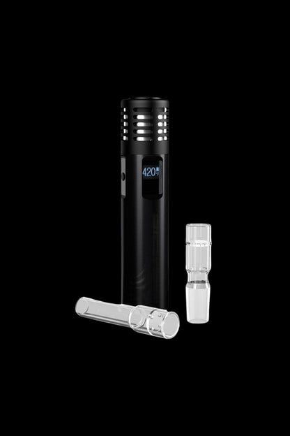 Black cannabis vaporizer pen with glass attachments on a dark background.