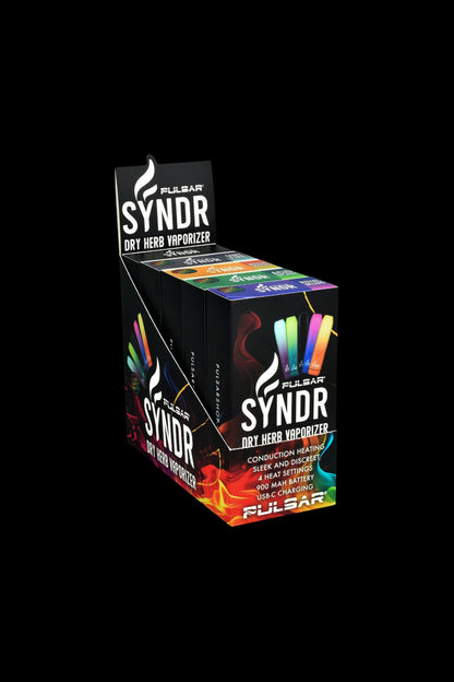 A display case showcasing Pulsar’s “Syndr” dry herb vaporizer packaging, featuring colorful, psychedelic designs and product details like heat settings and charging capabilities.