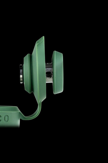 Close-up of a green cannabis oil applicator.