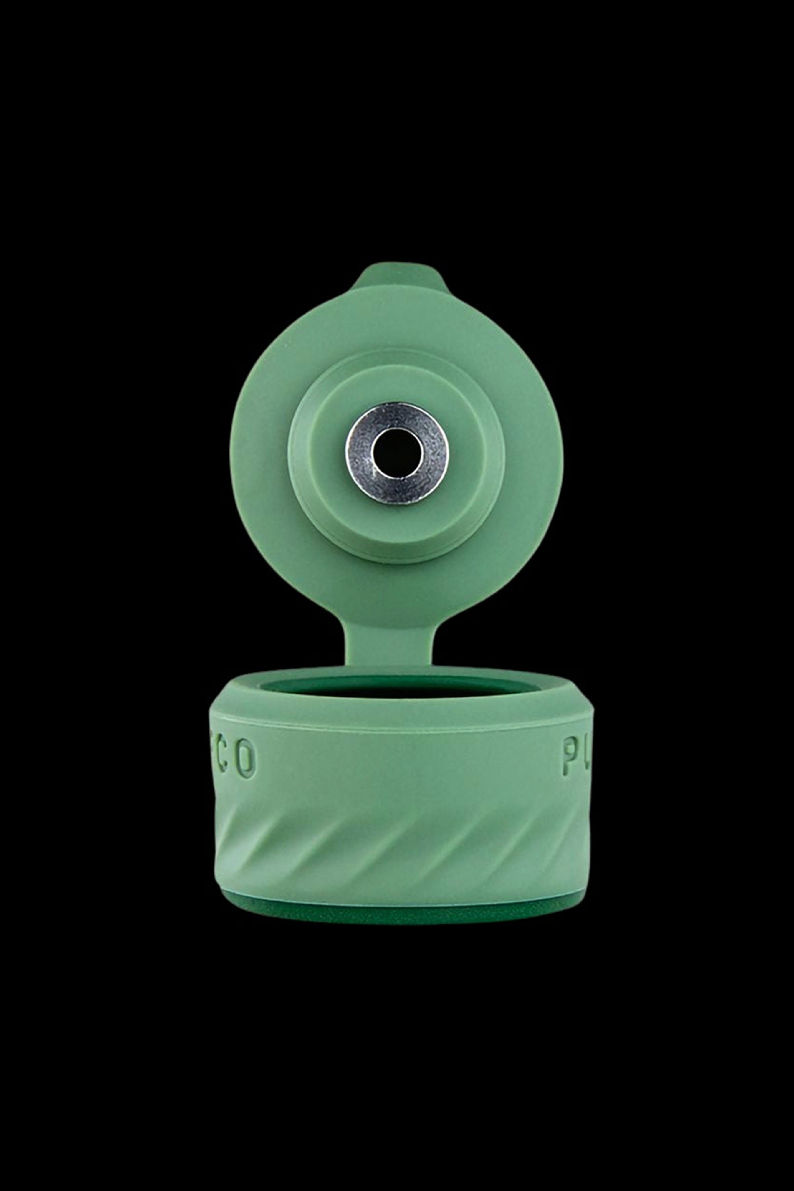 Green silicone cannabis oil container with open flip-top lid.