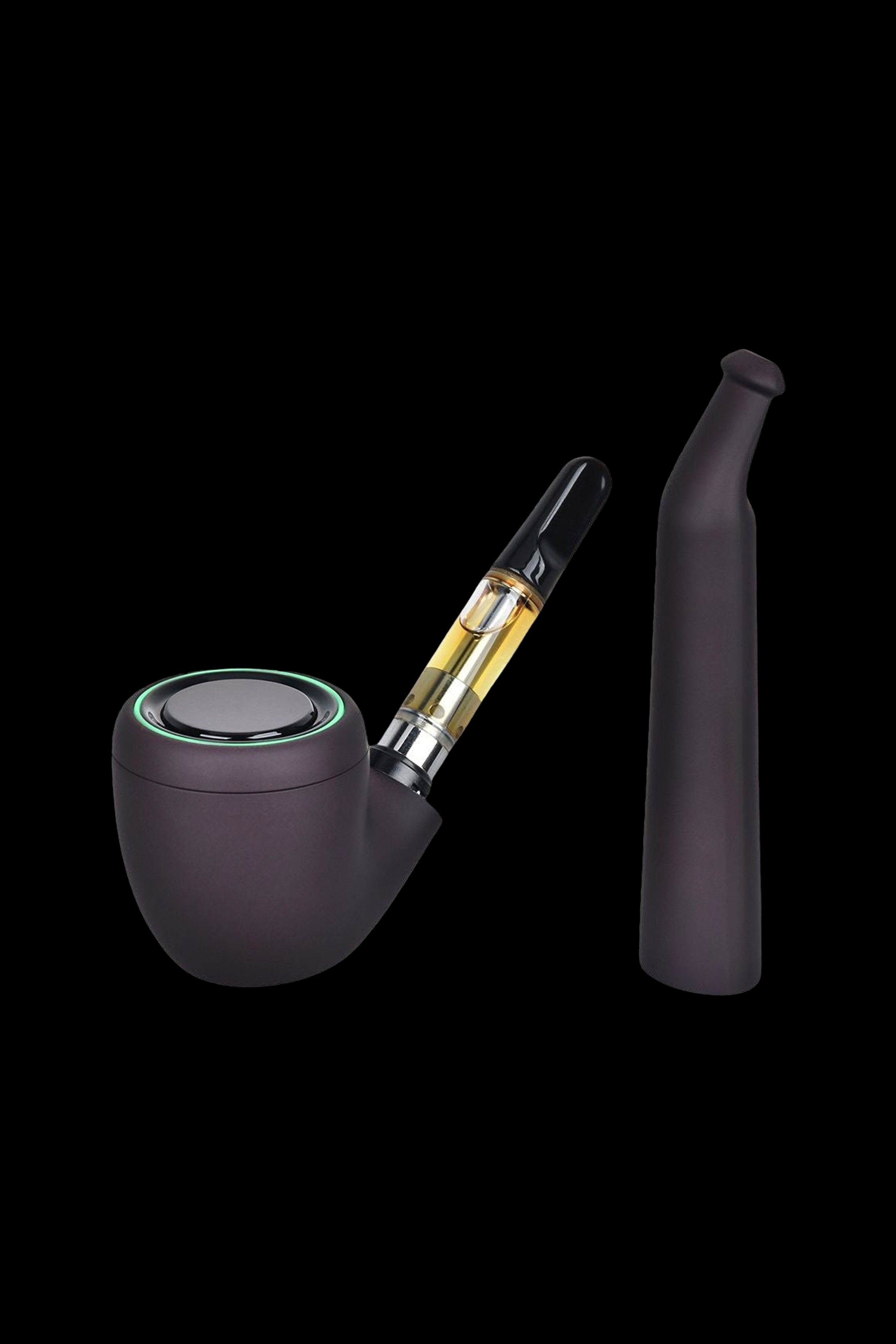 Sleek black cannabis oil vaporizer resembling a pipe, with a partially visible cartridge and mouthpiece against a dark background.