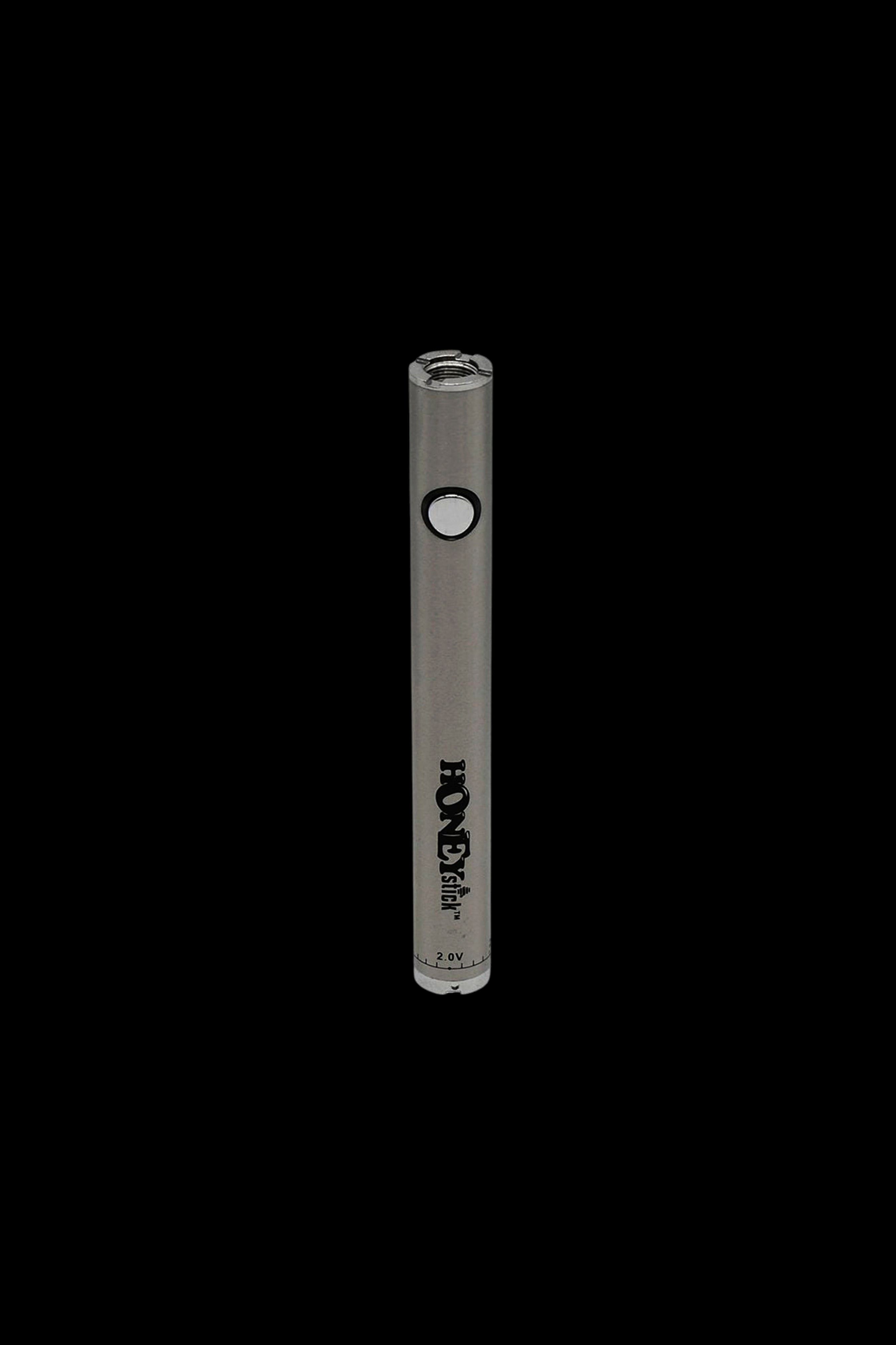 Sleek, metallic cannabis vape pen with “HoneyStick” branding against a black background.