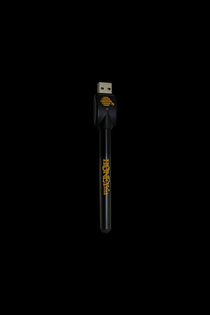 Black USB-powered dab pen with gold branding.