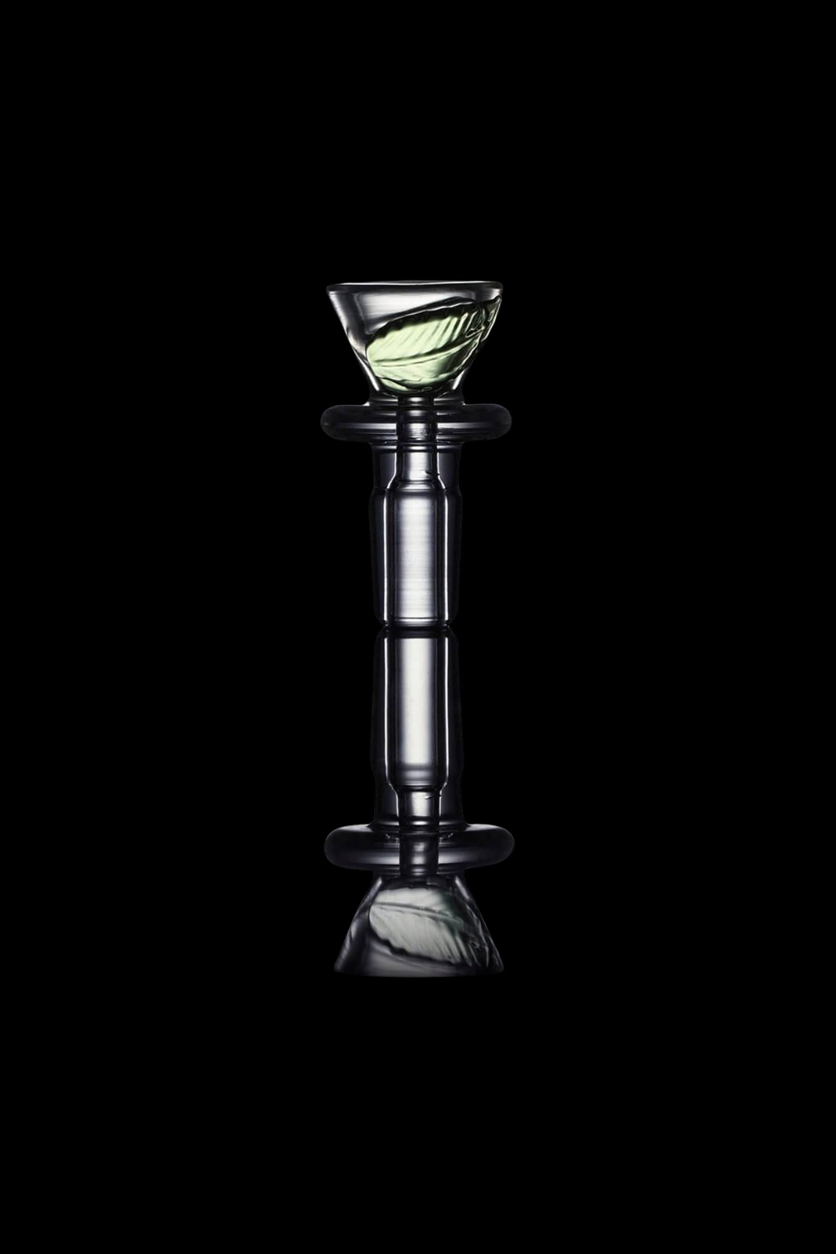 Glass cannabis water pipe against a black background.