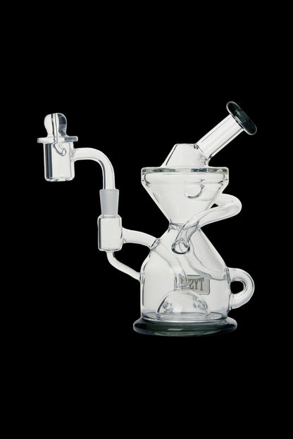 Clear glass dab rig with intricate curves and a quartz nail.