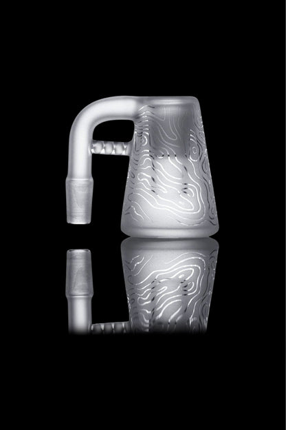 Silver glass cannabis water pipe with etched swirling patterns, isolated on black.