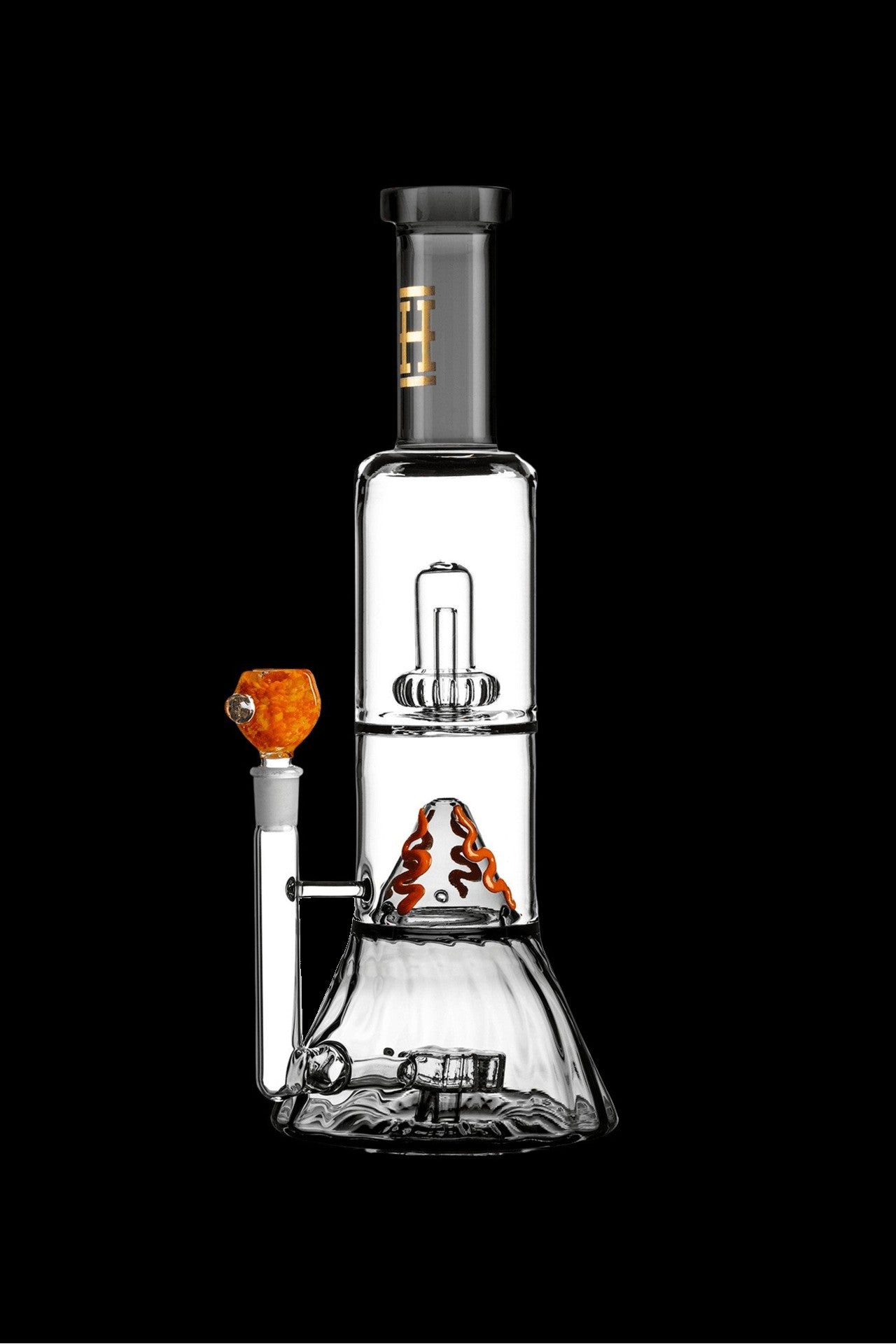 Glass water pipe (bong) with intricate percolators and a colored mouthpiece, isolated on a black background.