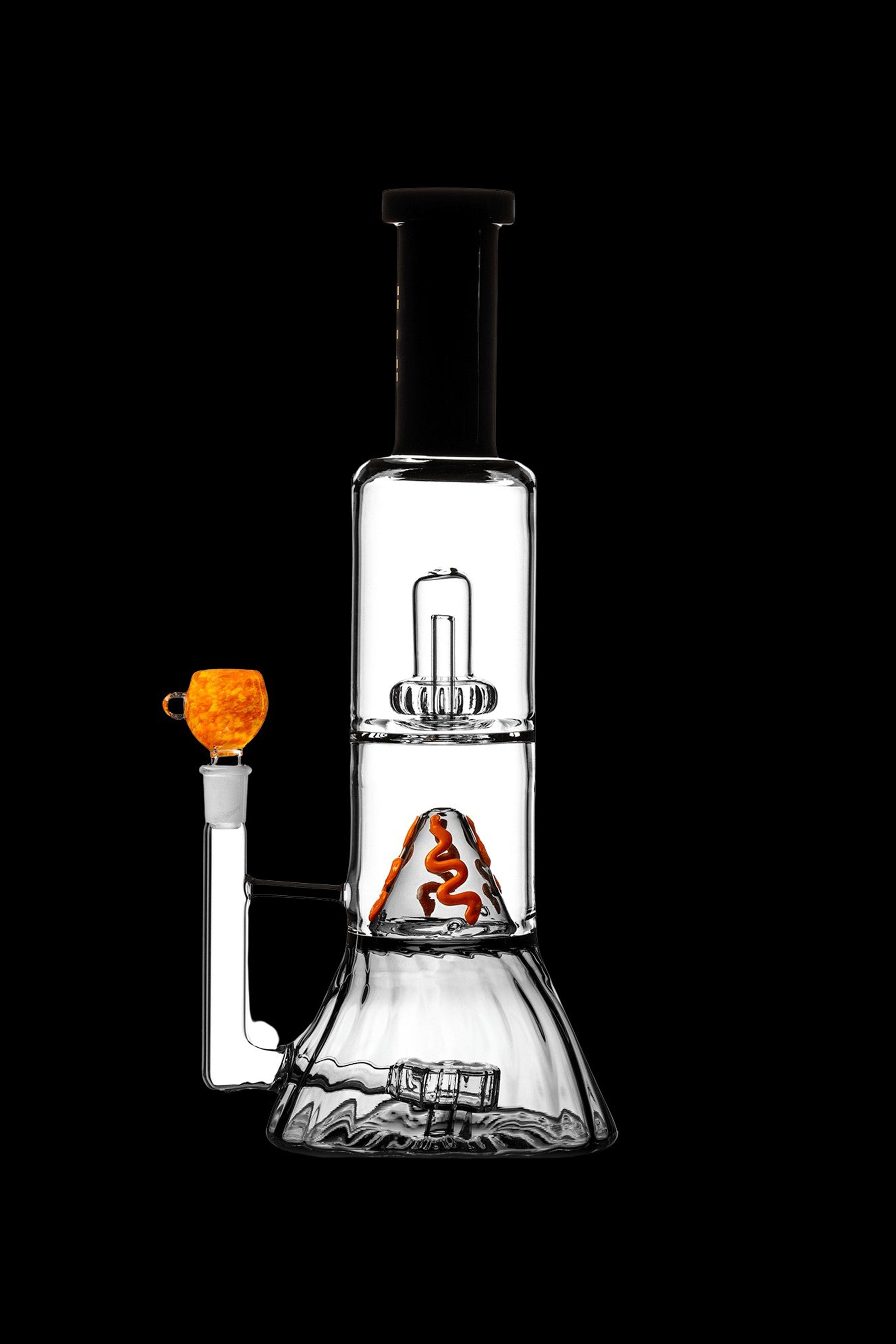 Clear glass water pipe (rig) with intricate percolators and an orange glass bowl.