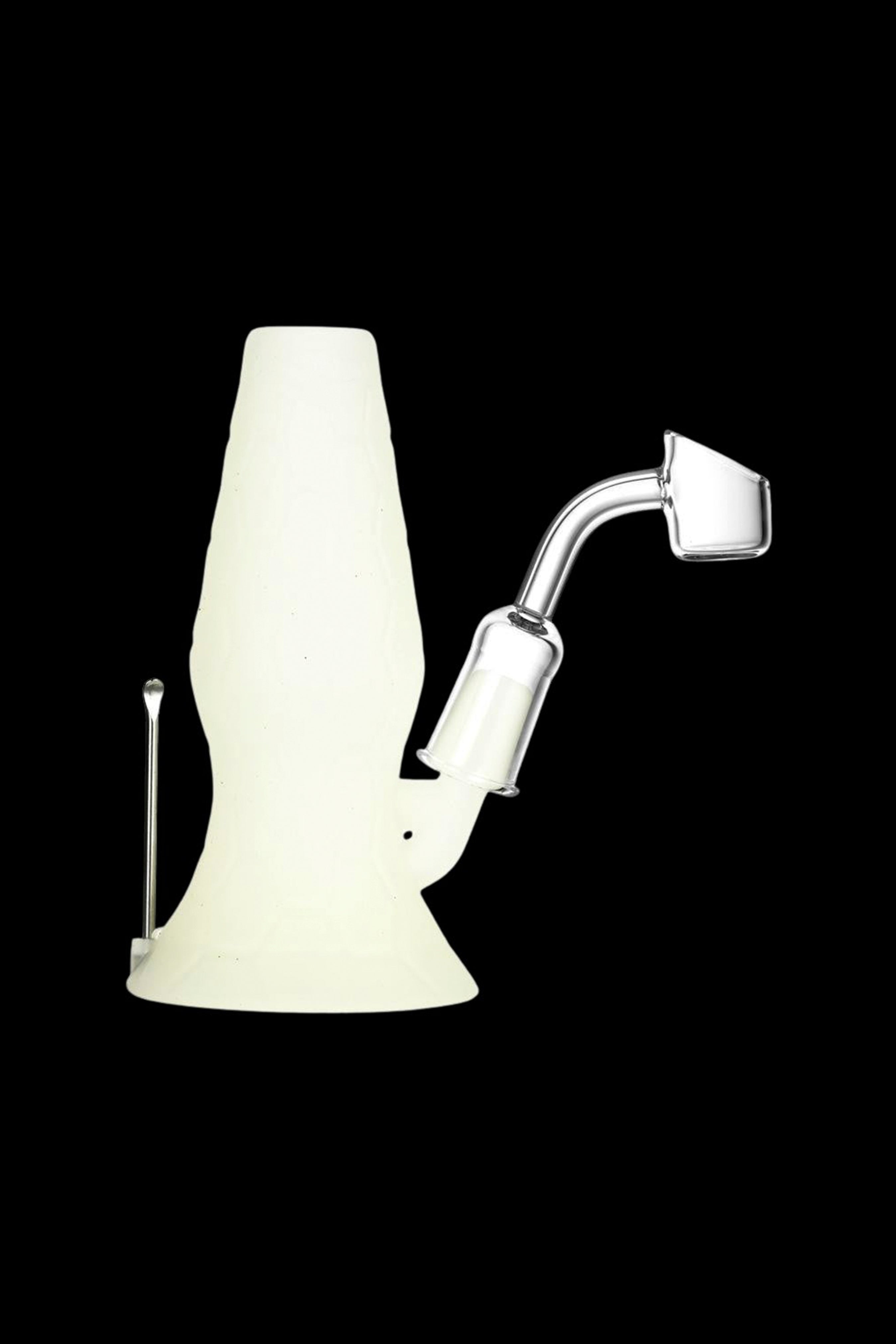 Cream-colored glass dab rig with a quartz banger and carb cap.