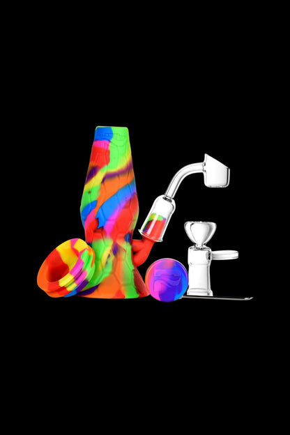 Colorful silicone water pipe and quartz dab rig with accessories.