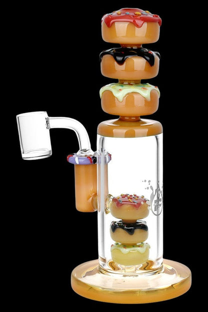 Glass water pipe shaped like a stack of colorful donuts, with a quartz banger attachment.