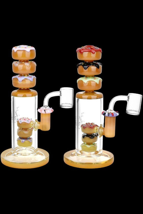 Two glass bongs with colorful donut-shaped percolators.