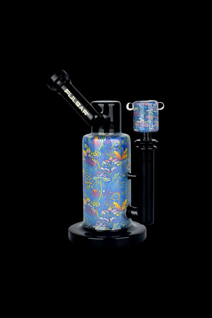 A colorful glass water pipe with floral designs, branded “Pulsar”, against a black background.